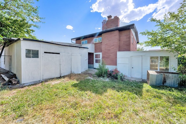 468 W 2400 S, Bountiful, UT 84010 - rear view of property featuring a shed, a chimney, a lawn, and brick siding