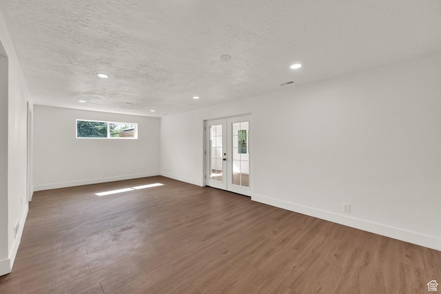 468 W 2400 S, Bountiful, UT 84010 - empty room featuring a textured ceiling, dark wood finished floors, and recessed lighting