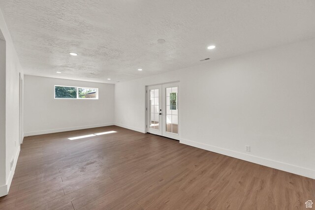 468 W 2400 S, Bountiful, UT 84010 - empty room featuring a textured ceiling, dark wood finished floors, and recessed lighting