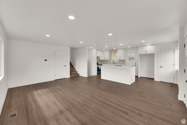 468 W 2400 S, Bountiful, UT 84010 - unfurnished living room with stairway, recessed lighting, and dark wood-style floors