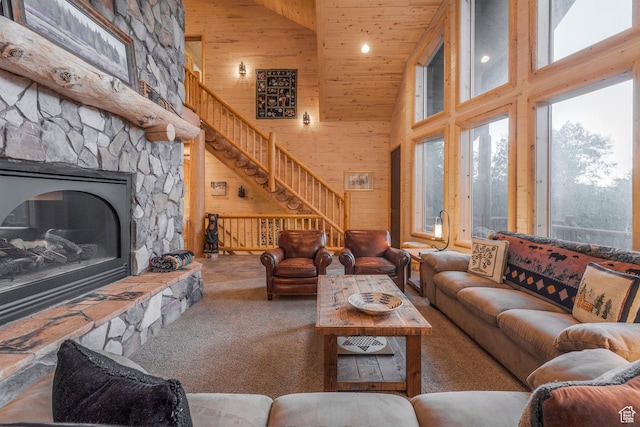 654 Sugar Pine Dr, Oakley, UT 84055 - carpeted living area with high vaulted ceiling, stairs, wood ceiling, a stone fireplace, and recessed lighting