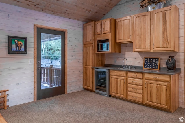 654 Sugar Pine Dr, Oakley, UT 84055 - kitchen with wine cooler, vaulted ceiling, wooden walls, light carpet, and dark countertops