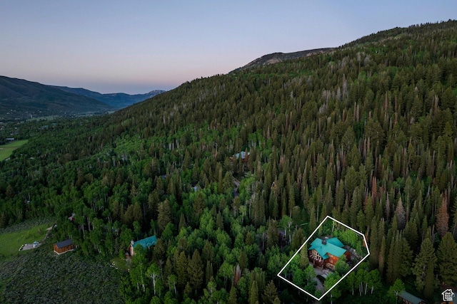 654 Sugar Pine Dr, Oakley, UT 84055 - aerial view at dusk of a view of trees, a mountain view, and property parcel outlined