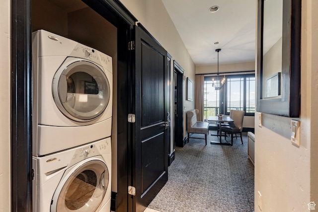 2100 W Frostwood Blvd Unit 3164, Park City, UT 84098 - laundry area featuring stacked washer / dryer and dark carpet