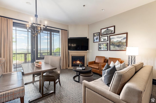 2100 W Frostwood Blvd Unit 3164, Park City, UT 84098 - living room featuring a chandelier, a glass covered fireplace, and carpet flooring