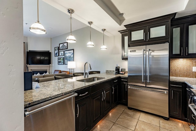 2100 W Frostwood Blvd Unit 3164, Park City, UT 84098 - kitchen with appliances with stainless steel finishes, backsplash, light stone counters, and dark cabinets
