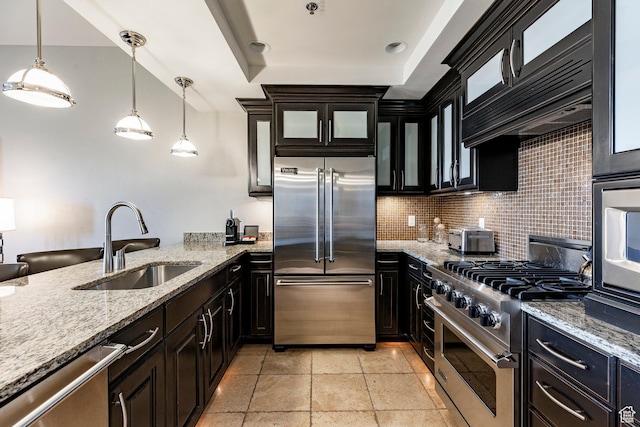 2100 W Frostwood Blvd Unit 3164, Park City, UT 84098 - kitchen featuring premium appliances, glass insert cabinets, tasteful backsplash, and hanging light fixtures