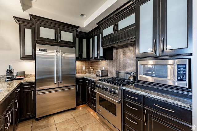 2100 W Frostwood Blvd Unit 3164, Park City, UT 84098 - kitchen with built in appliances, decorative backsplash, light stone countertops, and glass insert cabinets