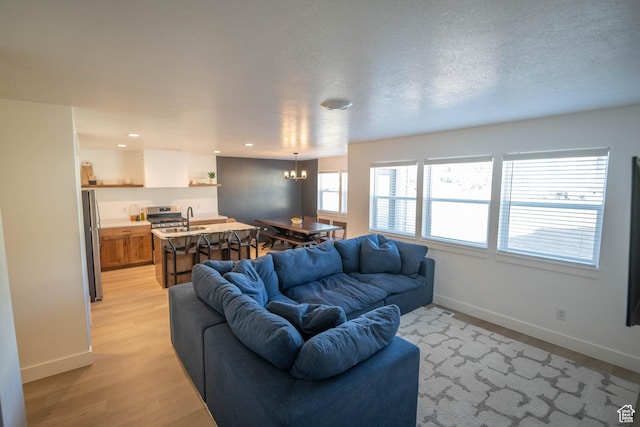 744 N 540 E, Smithfield, UT 84335 - living room with a chandelier, light wood-style floors, and recessed lighting
