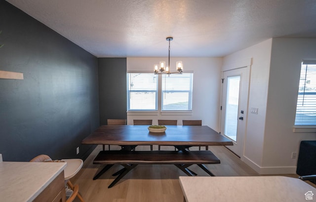 744 N 540 E, Smithfield, UT 84335 - dining room with wood finished floors, a chandelier, and a textured ceiling