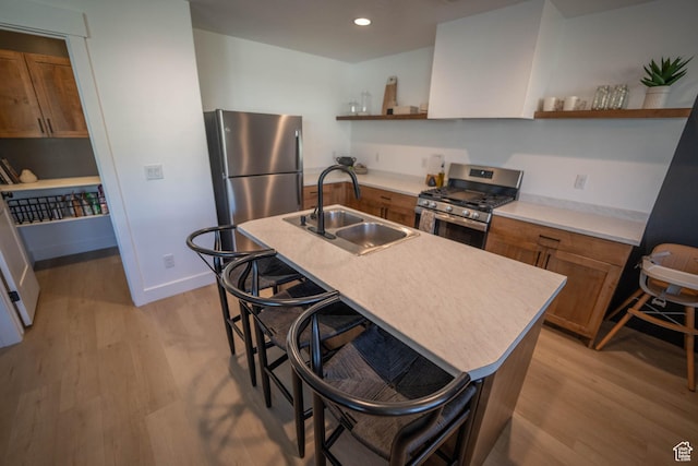 744 N 540 E, Smithfield, UT 84335 - kitchen with appliances with stainless steel finishes, open shelves, light wood finished floors, brown cabinets, and recessed lighting