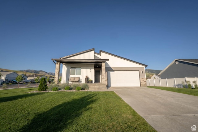 744 N 540 E, Smithfield, UT 84335 - view of front of home with a garage, concrete driveway, and a mountain view