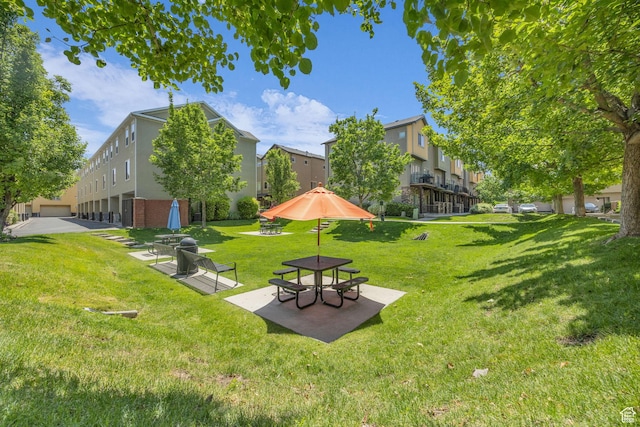 169 W Barry Links Way S, Salt Lake, UT 84115 - surrounding community featuring a lawn, a patio area, and a residential view