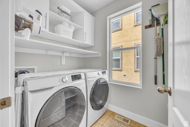 169 W Barry Links Way S, Salt Lake, UT 84115 - washroom with washer and dryer, cabinet space, and light tile patterned flooring