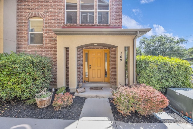 169 W Barry Links Way S, Salt Lake, UT 84115 - property entrance featuring stucco siding and brick siding