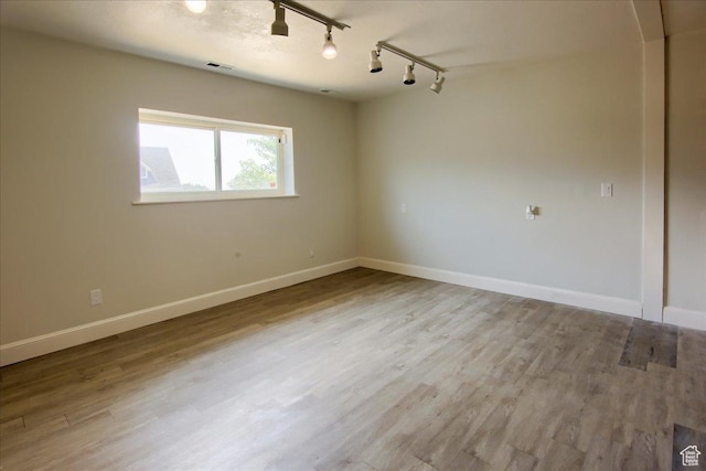 2839 S Oakwood Dr, Bountiful, UT 84010 - unfurnished room featuring rail lighting and wood finished floors