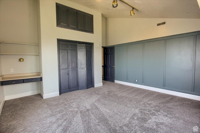 2839 S Oakwood Dr, Bountiful, UT 84010 - unfurnished bedroom with carpet, high vaulted ceiling, and rail lighting