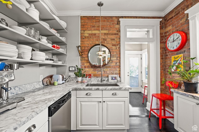 557 E 1 St Ave Unit 12, Salt Lake City, UT 84103 - kitchen with stainless steel dishwasher, brick wall, crown molding, white cabinets, and open shelves