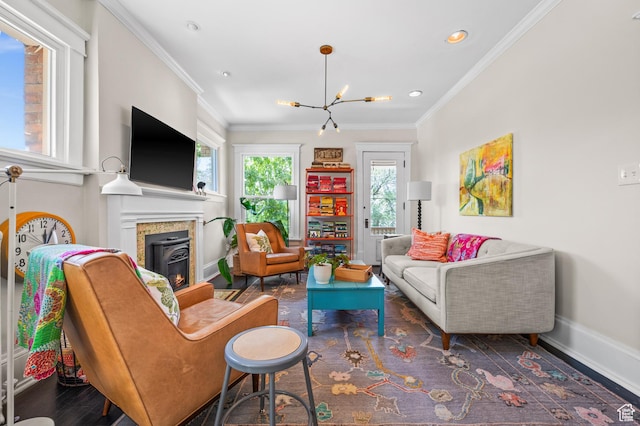 557 E 1 St Ave Unit 12, Salt Lake City, UT 84103 - living room with a chandelier, a glass covered fireplace, crown molding, recessed lighting, and wood finished floors
