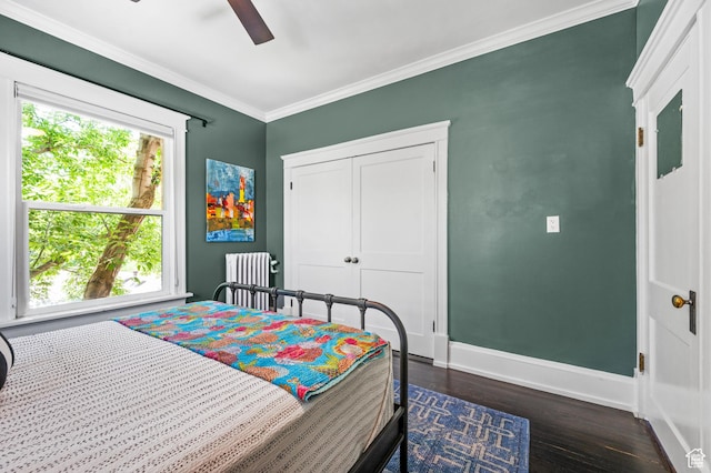 557 E 1 St Ave Unit 12, Salt Lake City, UT 84103 - bedroom featuring radiator, dark wood finished floors, ornamental molding, ceiling fan, and a closet