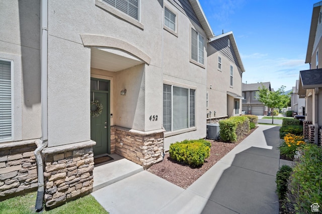 452 N Kent Dr, North Salt Lake, UT 84054 - property entrance with stucco siding, stone siding, and a residential view