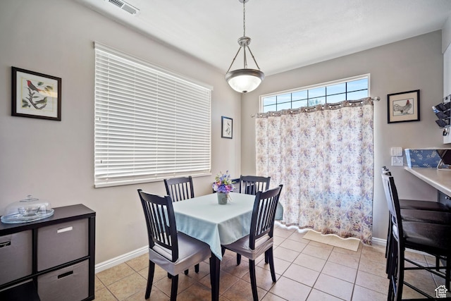 452 N Kent Dr, North Salt Lake, UT 84054 - dining space with light tile patterned floors and baseboards