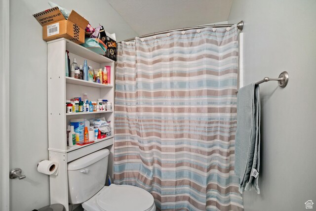 452 N Kent Dr, North Salt Lake, UT 84054 - bathroom with toilet and curtained shower