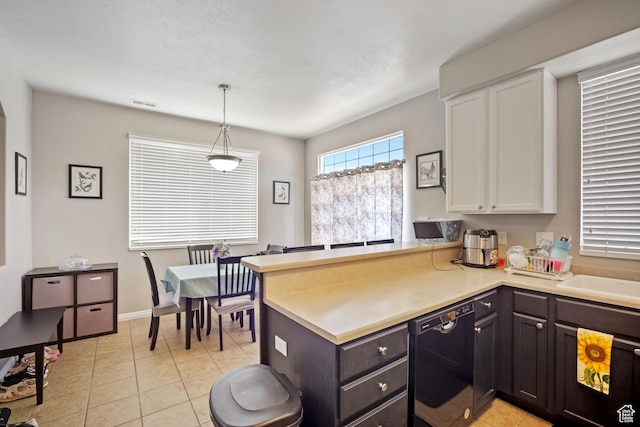 452 N Kent Dr, North Salt Lake, UT 84054 - kitchen featuring black dishwasher, white cabinetry, a peninsula, light countertops, and light tile patterned flooring