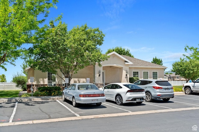452 N Kent Dr, North Salt Lake, UT 84054 - view of front facade featuring uncovered parking and stucco siding