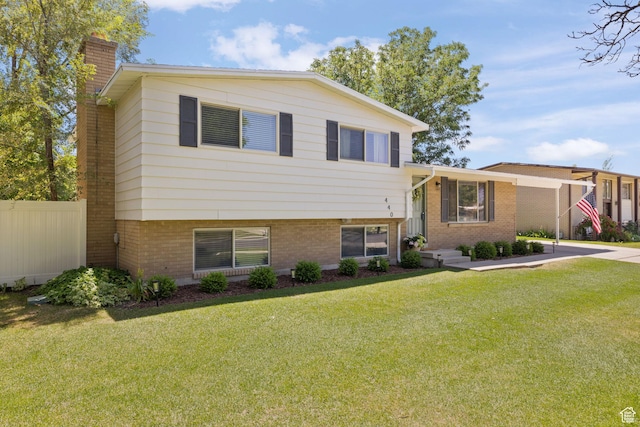 440 E Willow Ave, Murray, UT 84107 - split level home with a chimney and brick siding