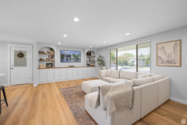 440 E Willow Ave, Murray, UT 84107 - living room with light wood finished floors, recessed lighting, and built in features
