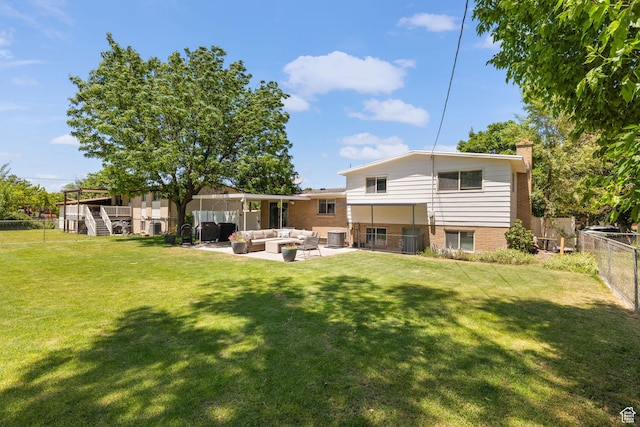 440 E Willow Ave, Murray, UT 84107 - back of house with an outdoor hangout area, a fenced backyard, a chimney, brick siding, and a patio