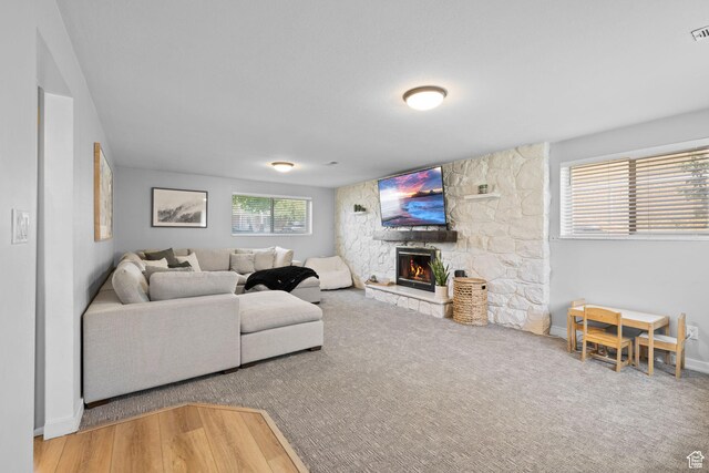 440 E Willow Ave, Murray, UT 84107 - living room featuring a stone fireplace and carpet flooring
