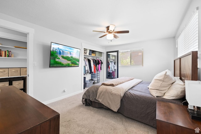 440 E Willow Ave, Murray, UT 84107 - carpeted bedroom with a tile fireplace, a closet, and ceiling fan