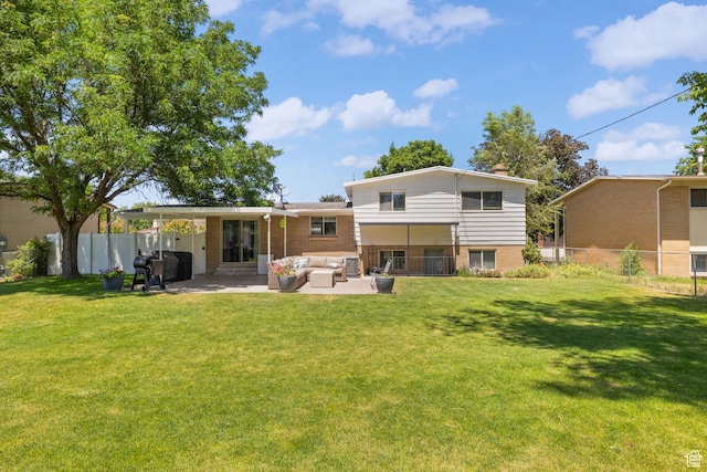 440 E Willow Ave, Murray, UT 84107 - rear view of house featuring an outdoor hangout area, a patio, a fenced backyard, a chimney, and brick siding