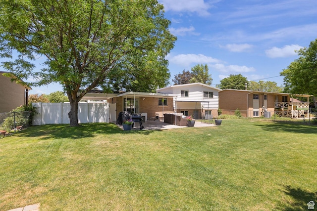 440 E Willow Ave, Murray, UT 84107 - back of property featuring brick siding, an outdoor living space, and a patio area