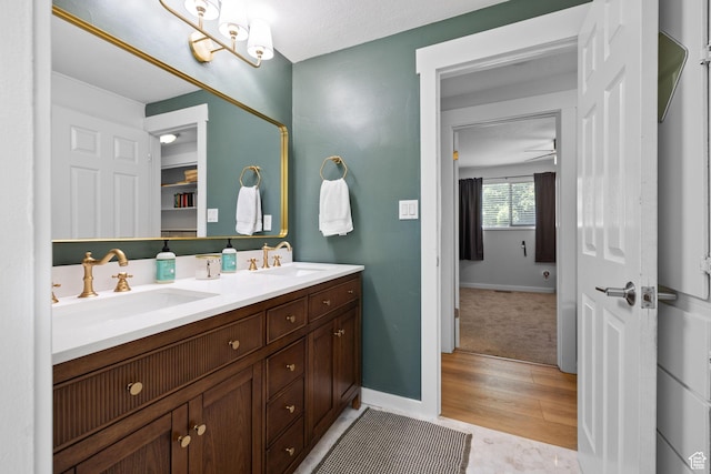 440 E Willow Ave, Murray, UT 84107 - full bathroom with double vanity and wood finished floors