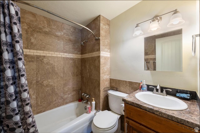 6204 S Jeremy Cir, Salt Lake City, UT 84121 - bathroom featuring shower / bath combo with shower curtain, vanity, and tile walls