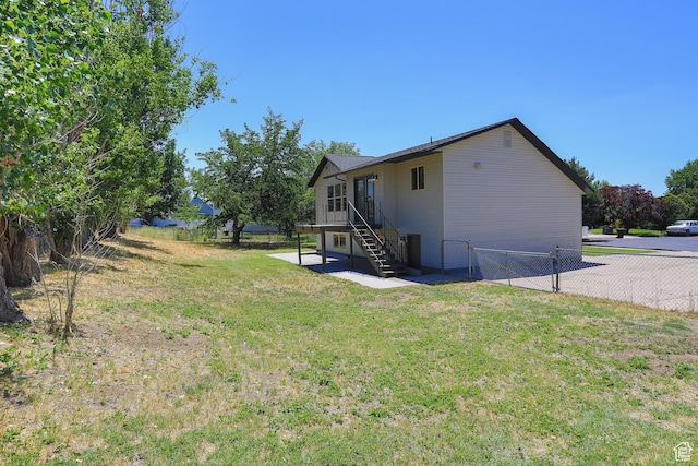 522 W 1060 N, Clinton, UT 84015 - rear view of house with a fenced backyard, stairway, and a patio area