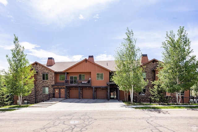 1261 W Black Rock Trl Unit 39D, Kamas, UT 84036 - multi unit property with stone siding, a garage, a chimney, concrete driveway, and a balcony