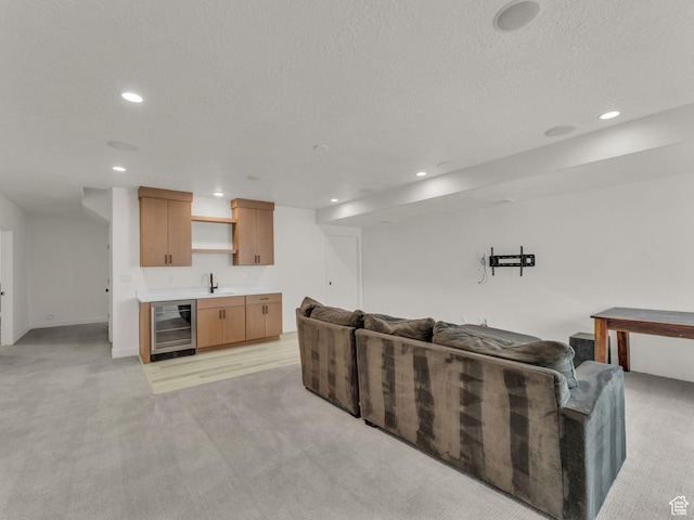 11609 S Dorian Dr W, South Jordan, UT 84009 - living room featuring beverage cooler, bar with sink, light carpet, recessed lighting, and a textured ceiling