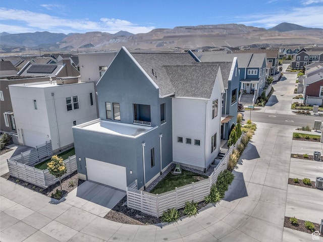 11609 S Dorian Dr W, South Jordan, UT 84009 - view of front of home featuring a mountain view, a garage, stucco siding, a residential view, and concrete driveway