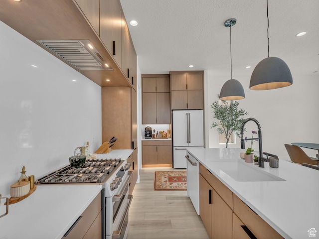 11609 S Dorian Dr W, South Jordan, UT 84009 - kitchen with white appliances, light countertops, light wood-type flooring, decorative light fixtures, and recessed lighting