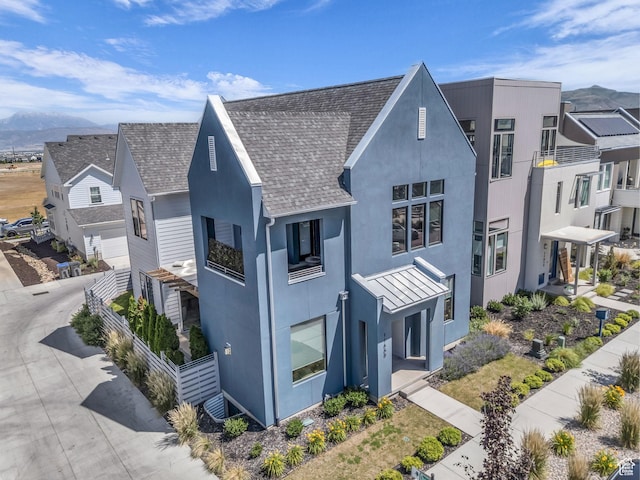 11609 S Dorian Dr W, South Jordan, UT 84009 - view of side of home with a mountain view, stucco siding, roof with shingles, and a standing seam roof