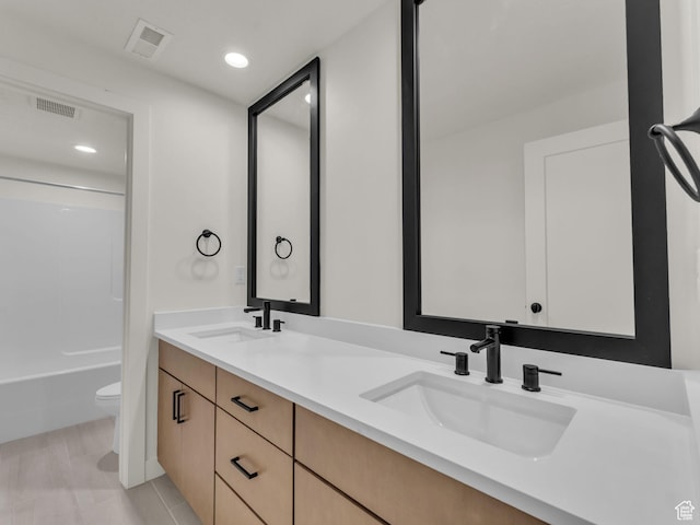 11609 S Dorian Dr W, South Jordan, UT 84009 - bathroom featuring double vanity, tub / shower combination, recessed lighting, and tile patterned flooring