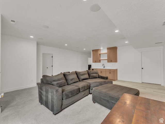 11609 S Dorian Dr W, South Jordan, UT 84009 - living area featuring recessed lighting, a textured ceiling, and light colored carpet