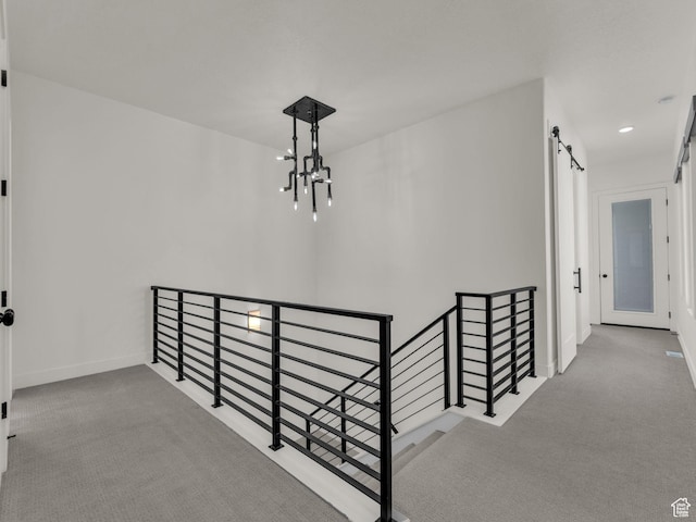 11609 S Dorian Dr W, South Jordan, UT 84009 - hall featuring an upstairs landing, a barn door, carpet floors, a chandelier, and recessed lighting
