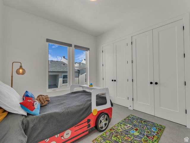 11609 S Dorian Dr W, South Jordan, UT 84009 - carpeted bedroom featuring two closets