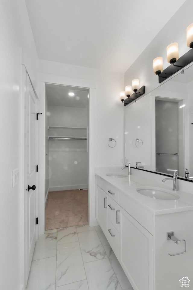 168 N 870 E, Tremonton, UT 84337 - full bath with double vanity, marble finish flooring, and a spacious closet