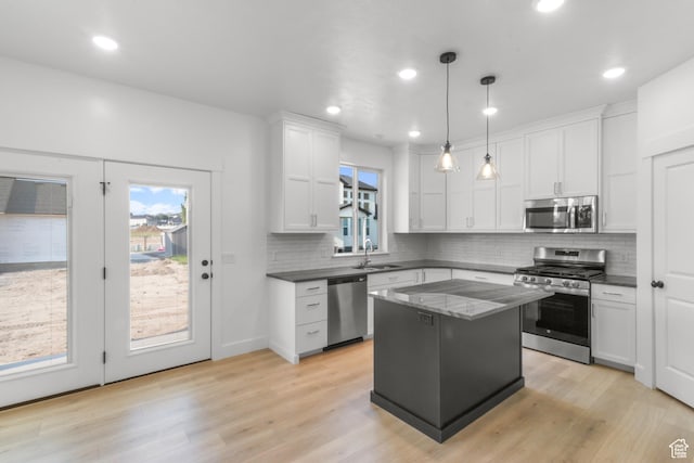 168 N 870 E, Tremonton, UT 84337 - kitchen featuring stainless steel appliances, dark countertops, backsplash, and recessed lighting